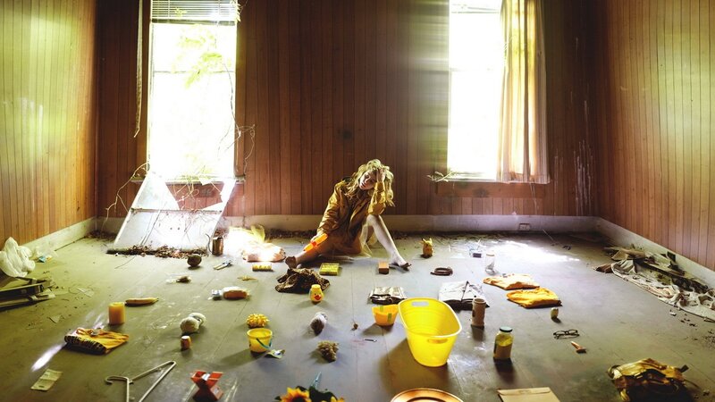 woman in a cluttered room