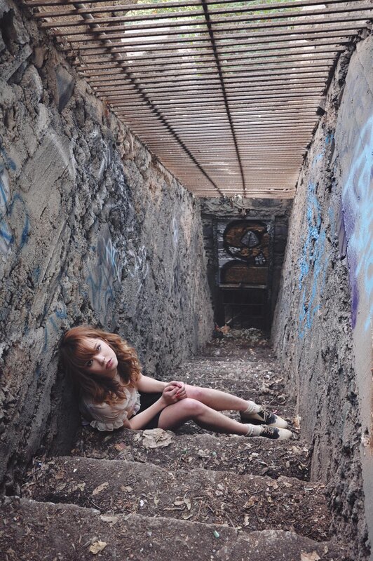 Woman in a concrete tunnel