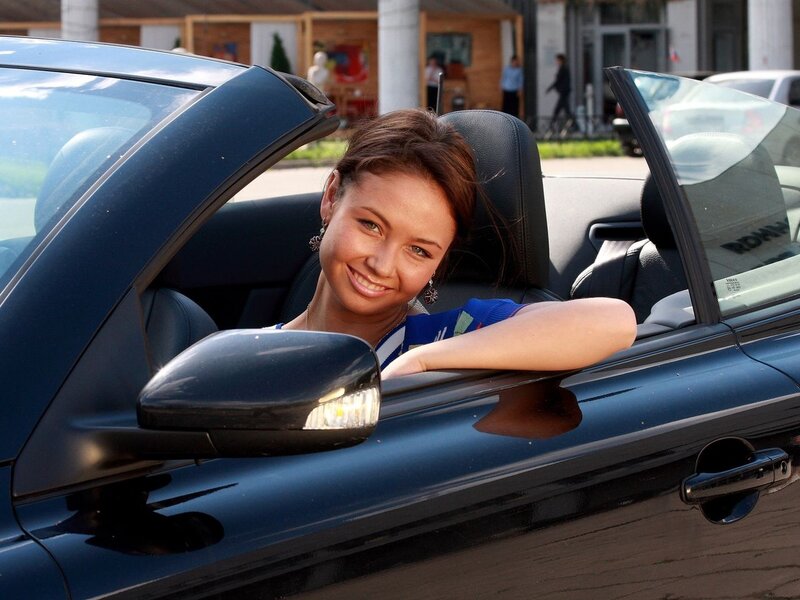 Woman in a convertible car