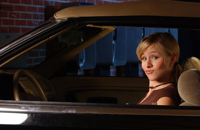 woman in a convertible car
