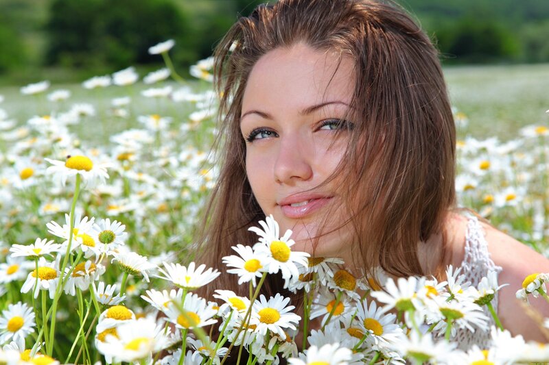 woman in a daisy field