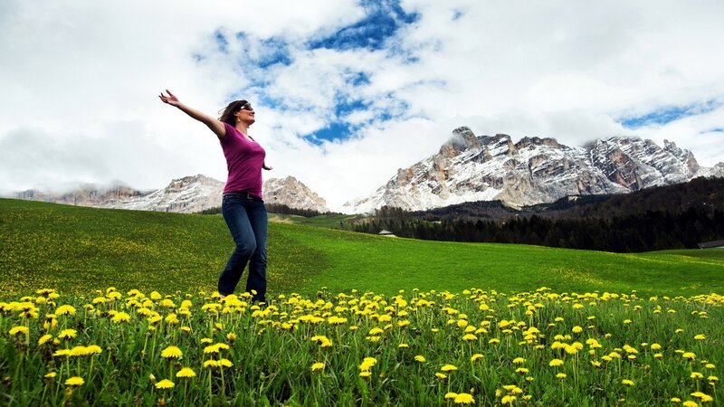 Woman in a dandelion field