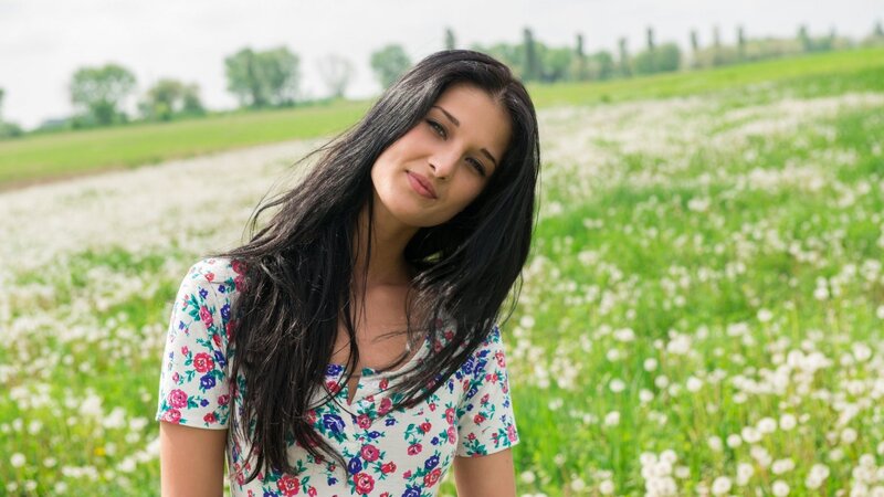 woman in a dandelion field