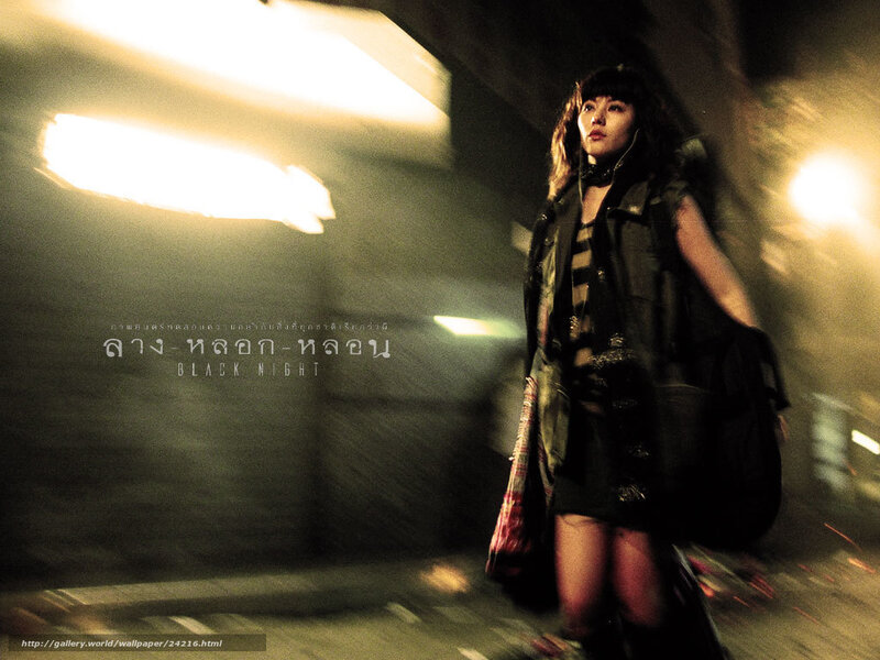 Woman in a dark alley at night