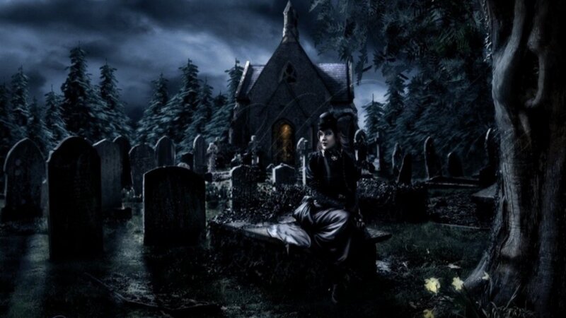 woman in a dark cemetery