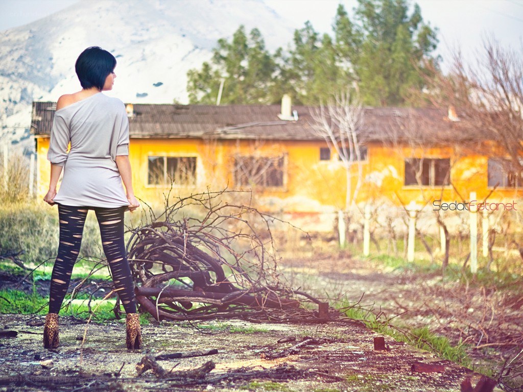 Woman in a desolate landscape