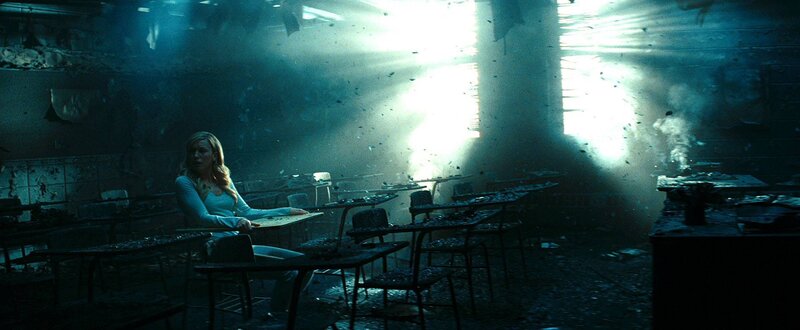 Woman in a destroyed classroom