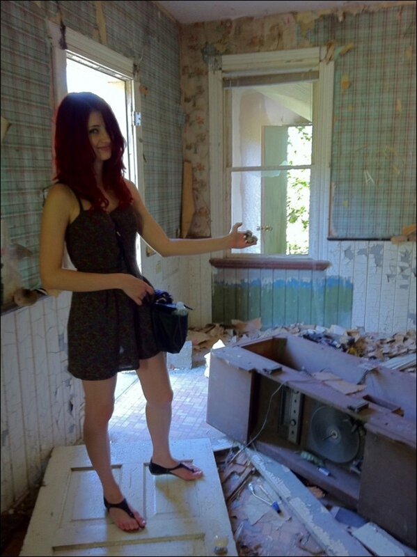 Woman in a dilapidated room