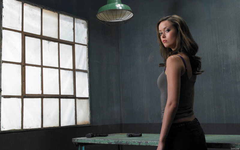 Woman in a Dim Room — Gray