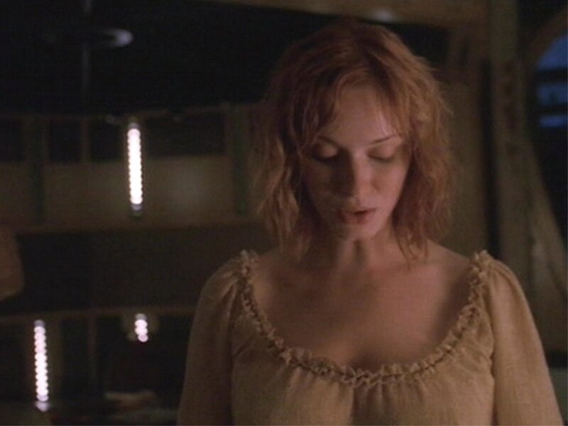 woman in a dimly lit room