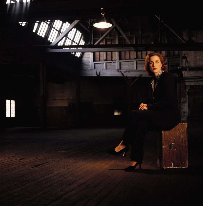 Woman in a dimly lit warehouse