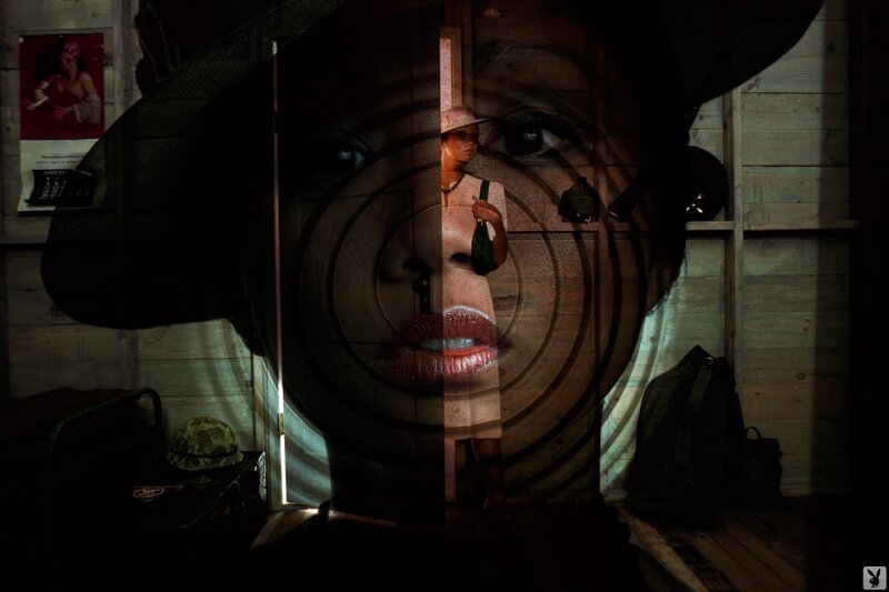 woman in a doorway with face projection
