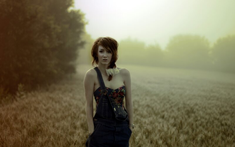 woman in a field at dawn