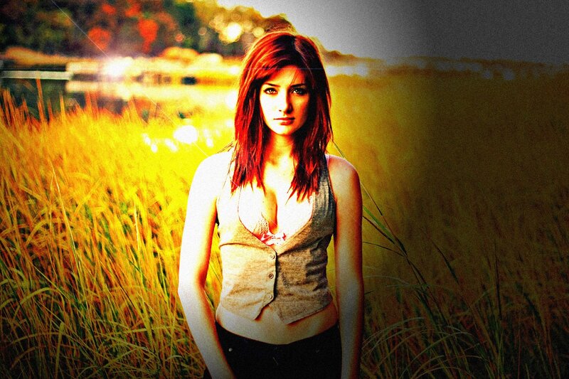woman in a field at sunset