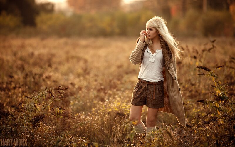 Woman in a field at sunset