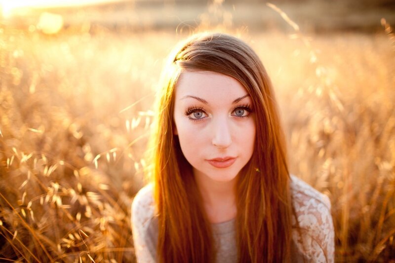 woman in a field at sunset