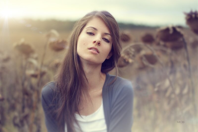 woman in a field at sunset