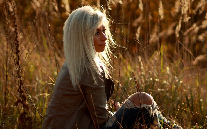 woman in a field at sunset