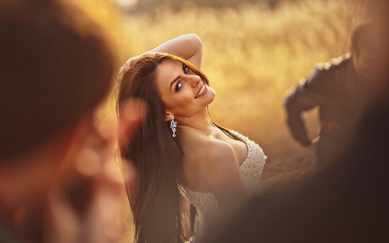 woman in a field at sunset