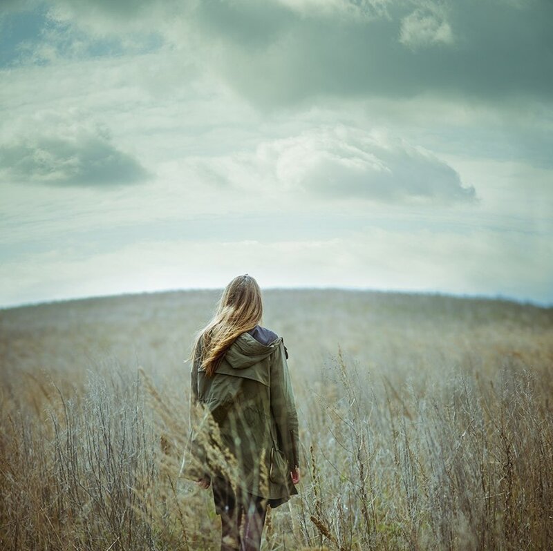 Woman in a Field — Green, Contemplative