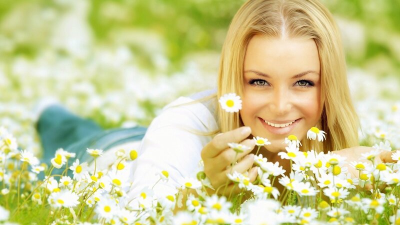 woman in a field of daisies