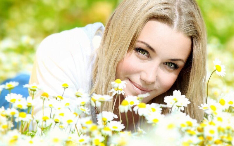 woman in a field of daisies