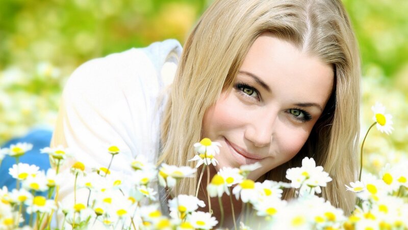 woman in a field of daisies