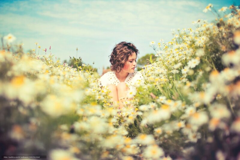 woman in a field of daisies