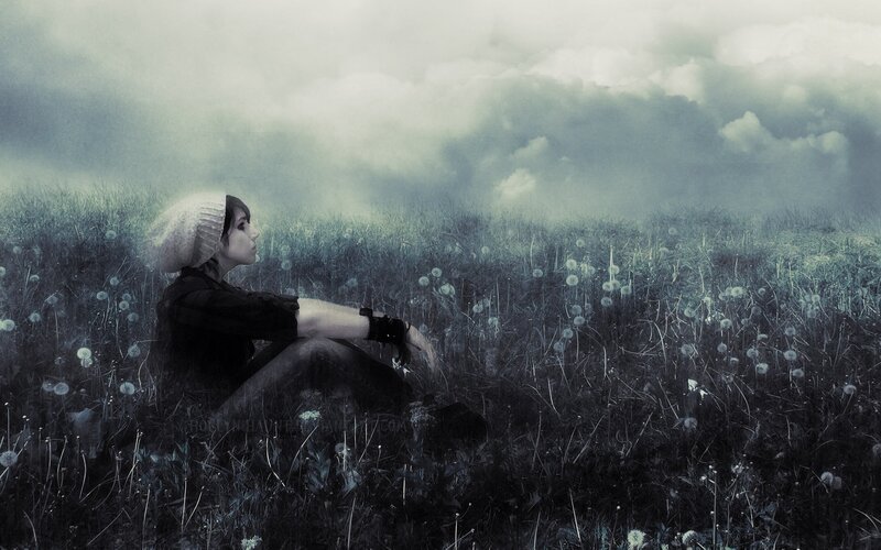woman in a field of dandelions