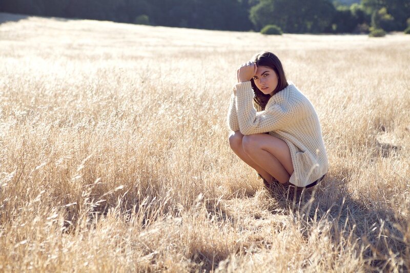 Woman in a field of dry grass