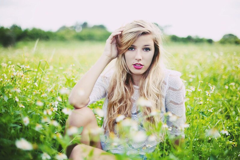 woman in a field of flowers