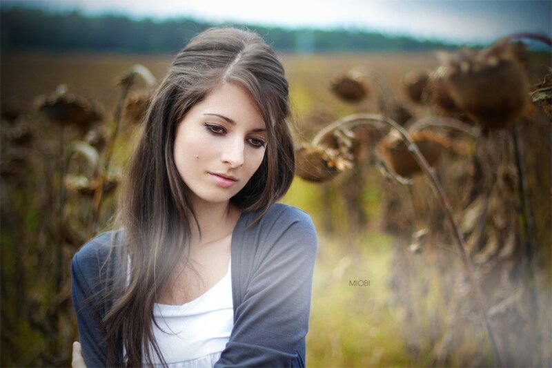 woman in a field of sunflowers