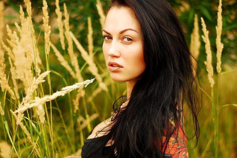 woman in a field of tall grass