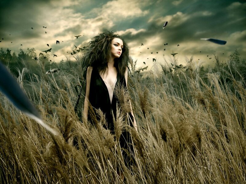 woman in a field of tall grass