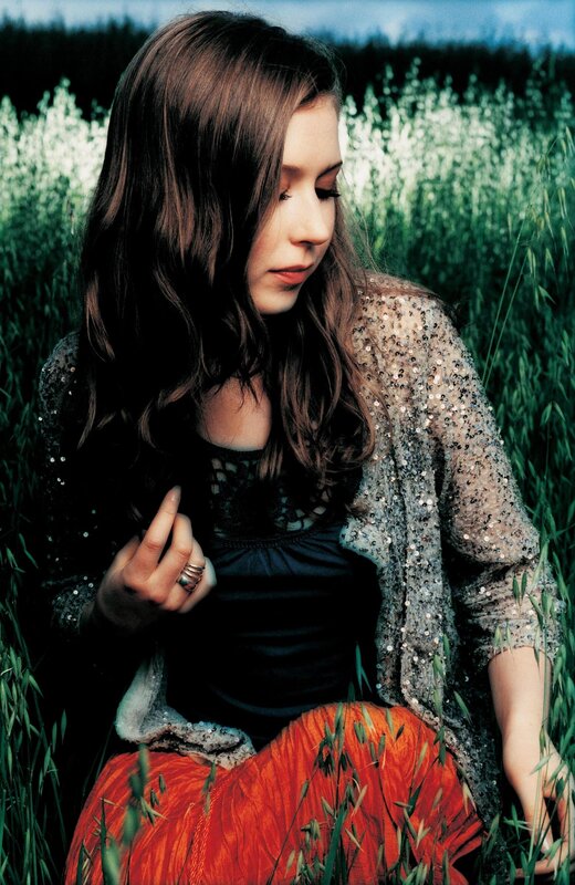 woman in a field of tall grass