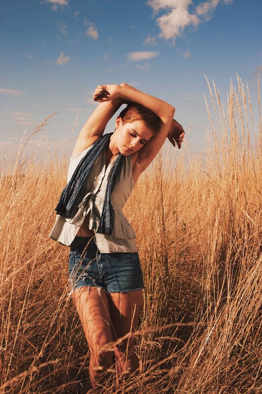 woman in a field of tall grass