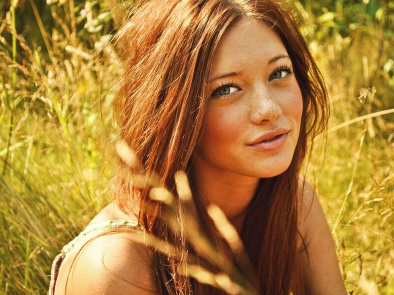 woman in a field of tall grass