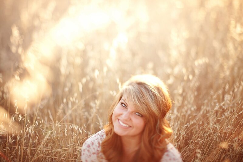 woman in a field of tall grass