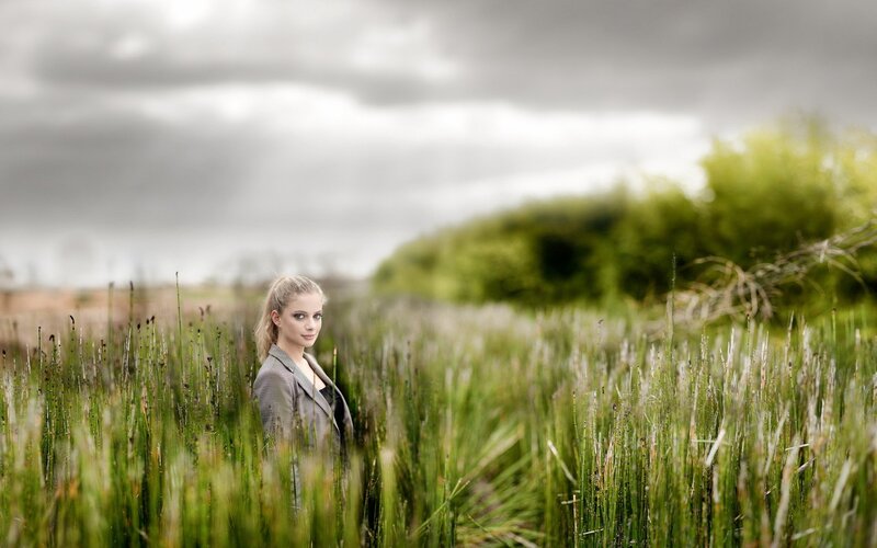 Woman in a field of tall grass