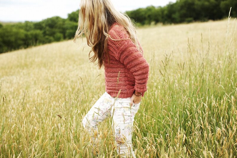 Woman in a field of tall grass