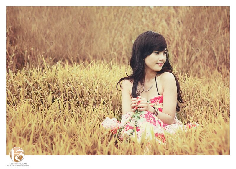woman in a field of tall grass