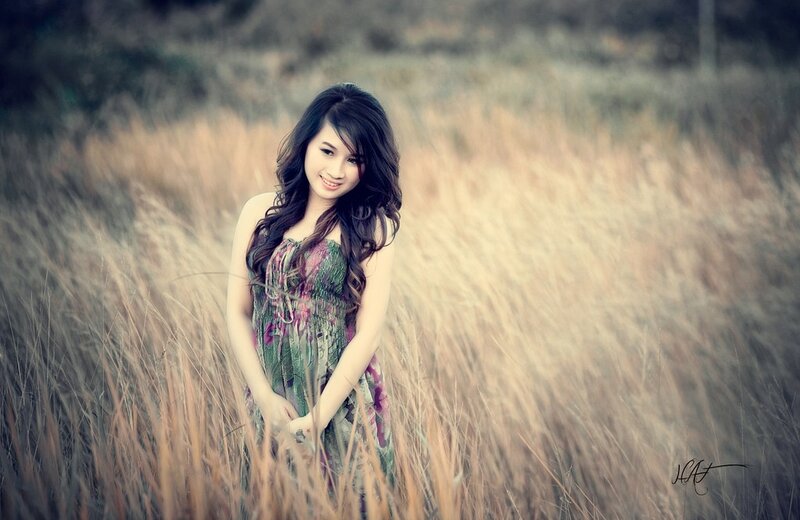 Woman in a field of tall grass