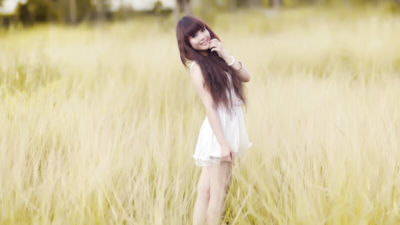 Woman in a field of tall grass