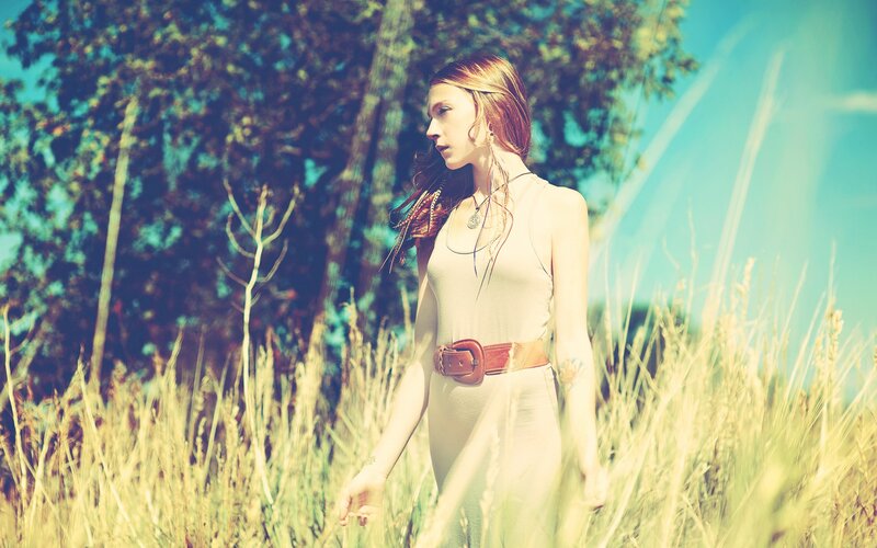 woman in a field of tall grass