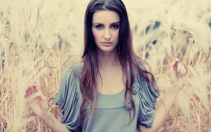 woman in a field of tall grass