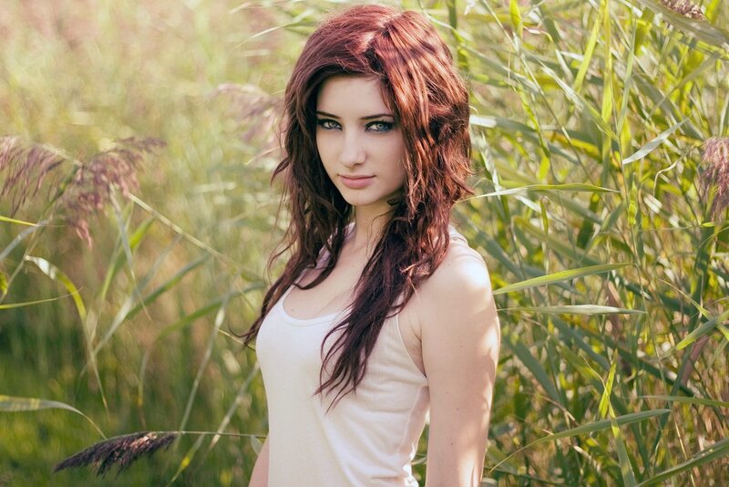 woman in a field of tall grass