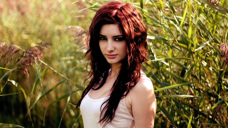 woman in a field of tall grass