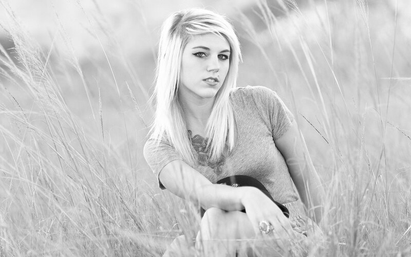 woman in a field of tall grass