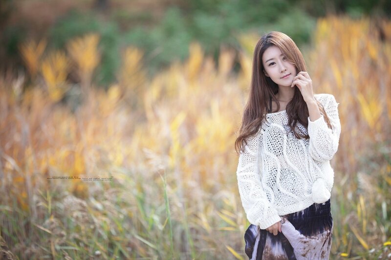 Woman in a field of tall grass