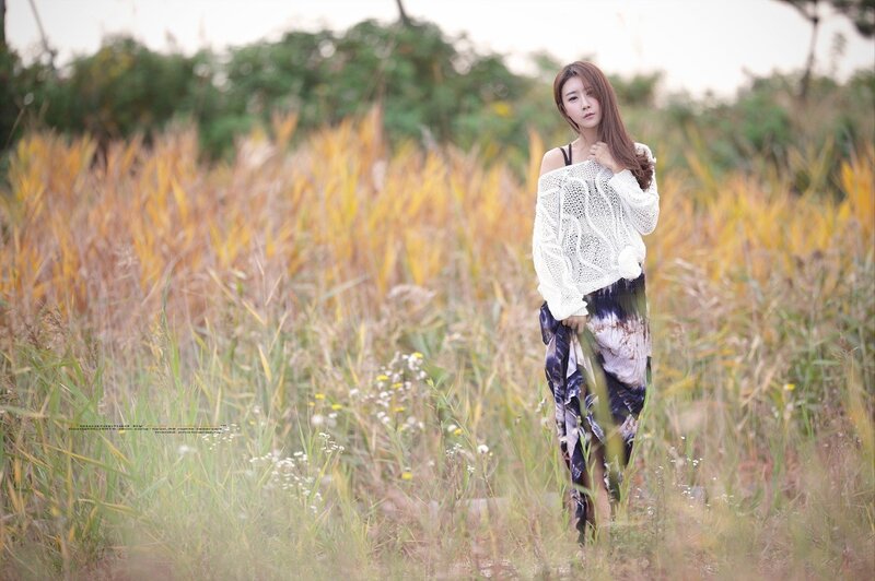 Woman in a field of tall grass